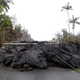 Lava and downed power lines block a road in the Leilani Estates subdivision during ongoing eruptions of the Kilauea volcano, May 8, 2018.
